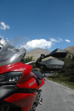 Red Ducati, blue skies, crisp mountain air - the setting for an epic ride. 
